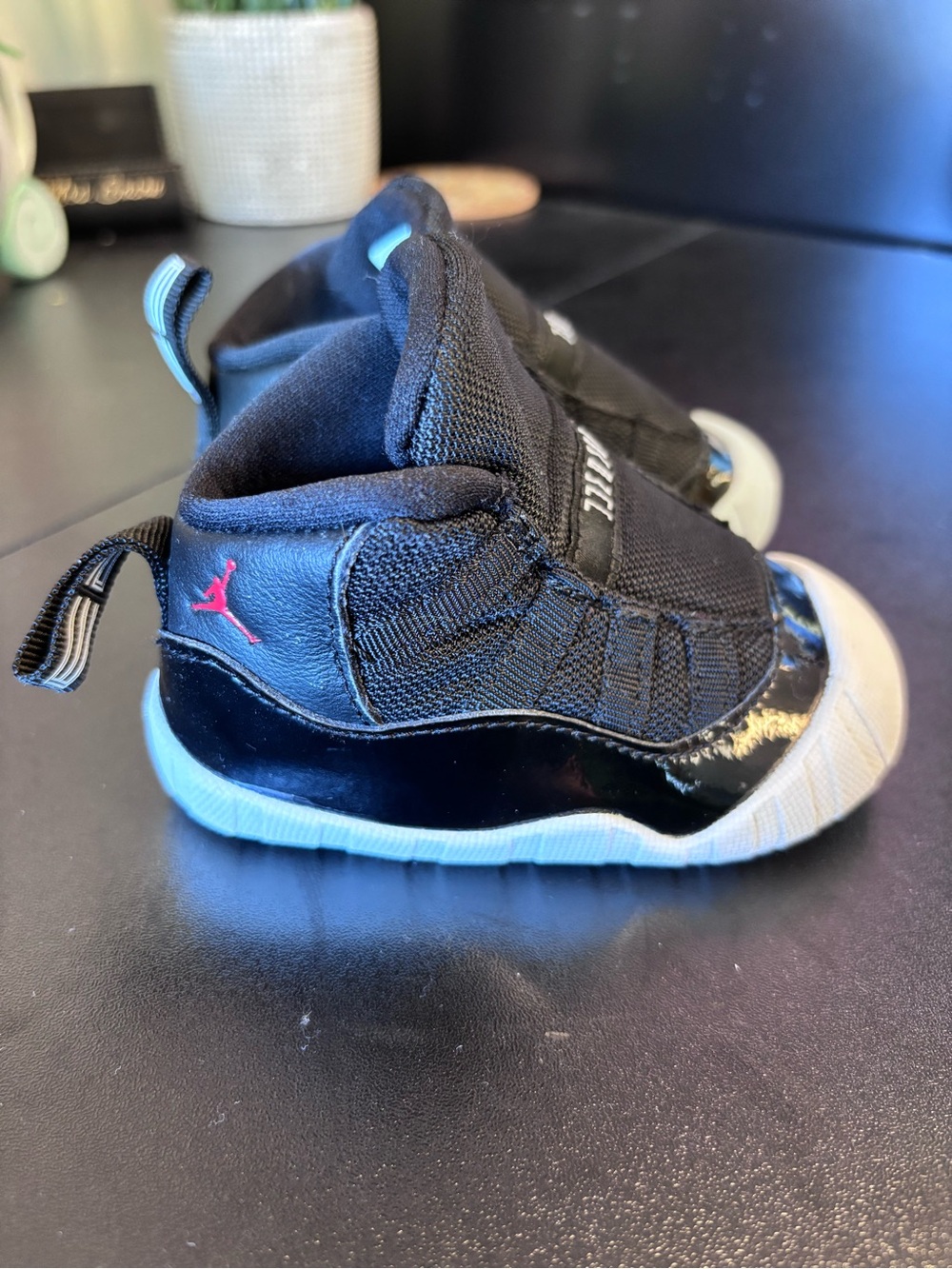 Nike Kids Black and White Slip-On Sneakers with Red Logo